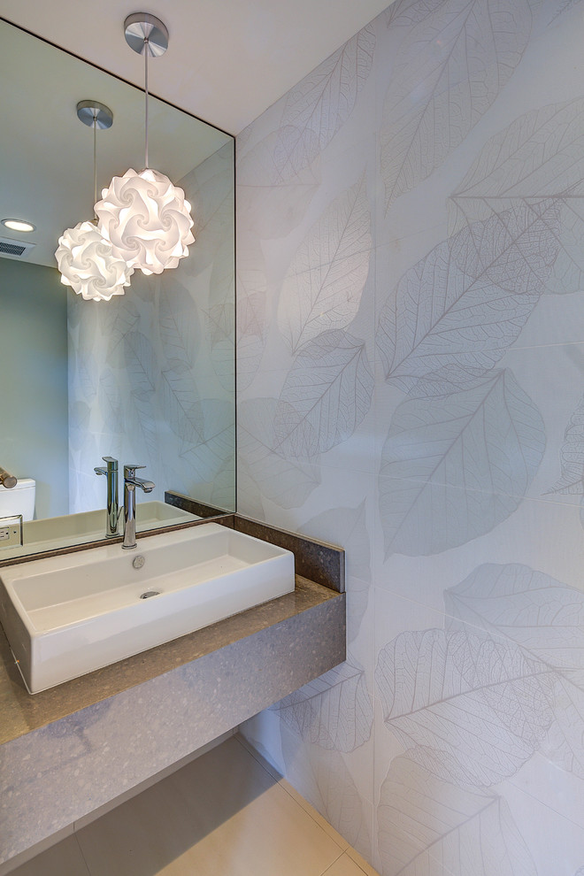 Inspiration for a small contemporary powder room in Hawaii with a vessel sink, white tile, porcelain floors, quartzite benchtops and brown benchtops.