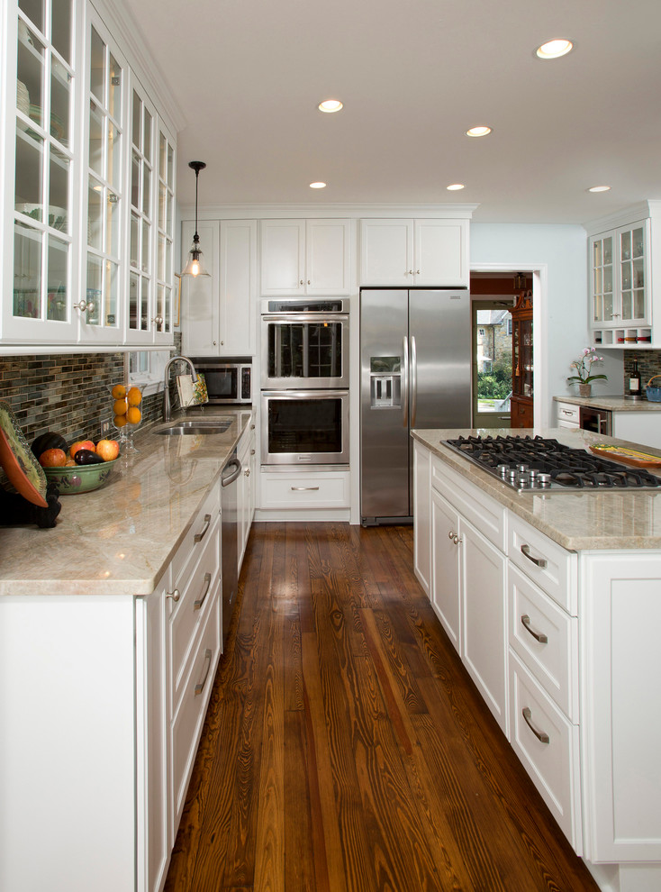 Inspiration for a small traditional l-shaped separate kitchen in DC Metro with a double-bowl sink, recessed-panel cabinets, white cabinets, granite benchtops, green splashback, glass tile splashback, stainless steel appliances, medium hardwood floors and with island.