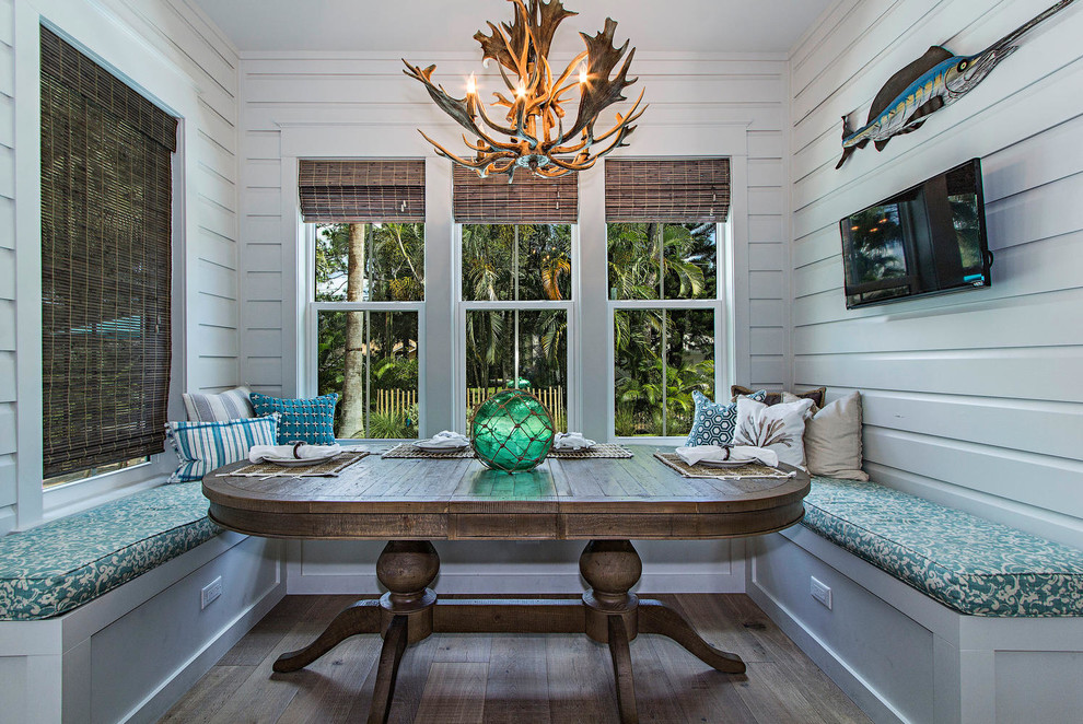 Beach style separate dining room in Miami with white walls and medium hardwood floors.