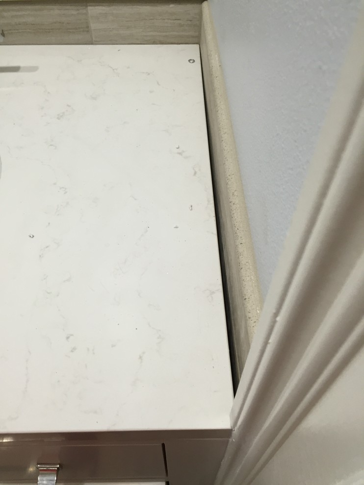 How to Fix this Gap between vanity and wall?