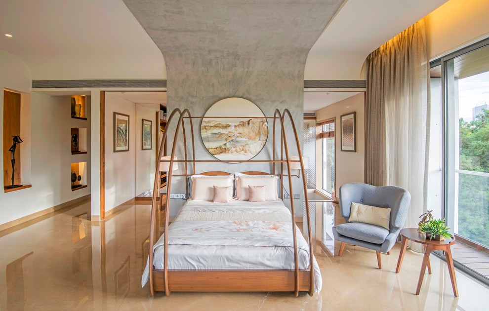 Photo of an asian master bedroom in Pune with beige walls and beige floor.