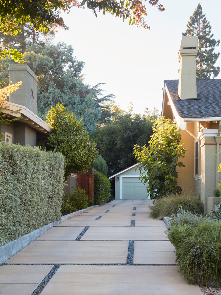 This is an example of a mid-sized arts and crafts side yard full sun driveway for spring in San Francisco with a vegetable garden and concrete pavers.