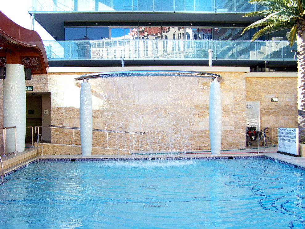Example of a large trendy pool fountain design