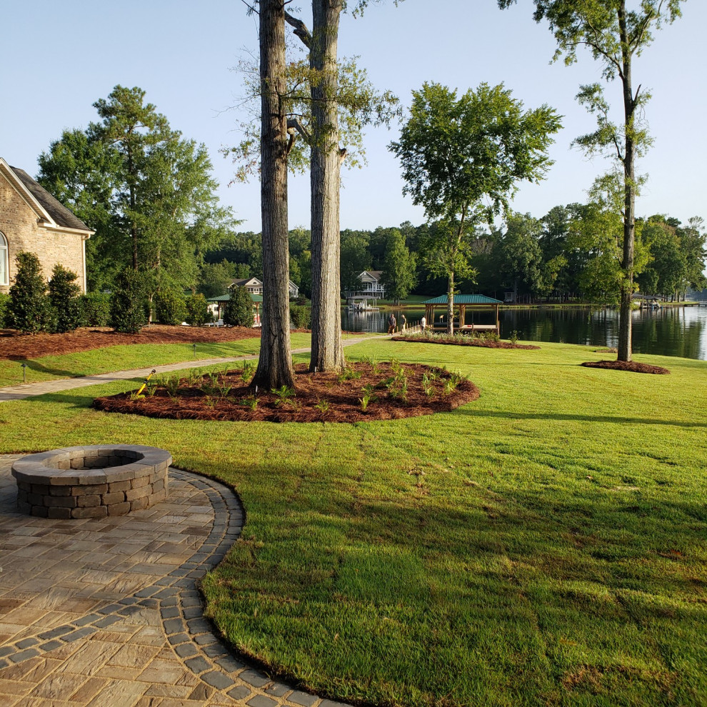 This is an example of a traditional drought-tolerant backyard landscaping with a fire pit.