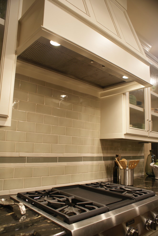 Large transitional medium tone wood floor kitchen photo in Dallas with an undermount sink, flat-panel cabinets, white cabinets, granite countertops, ceramic backsplash, stainless steel appliances, beige walls and an island