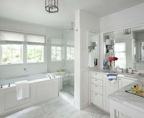 Packing the shower between the vanity and the soaking tub is a clever way to save space, especially when space is at a premium. Keeping the color palette light and bright helps keep the space feeling open and airy.