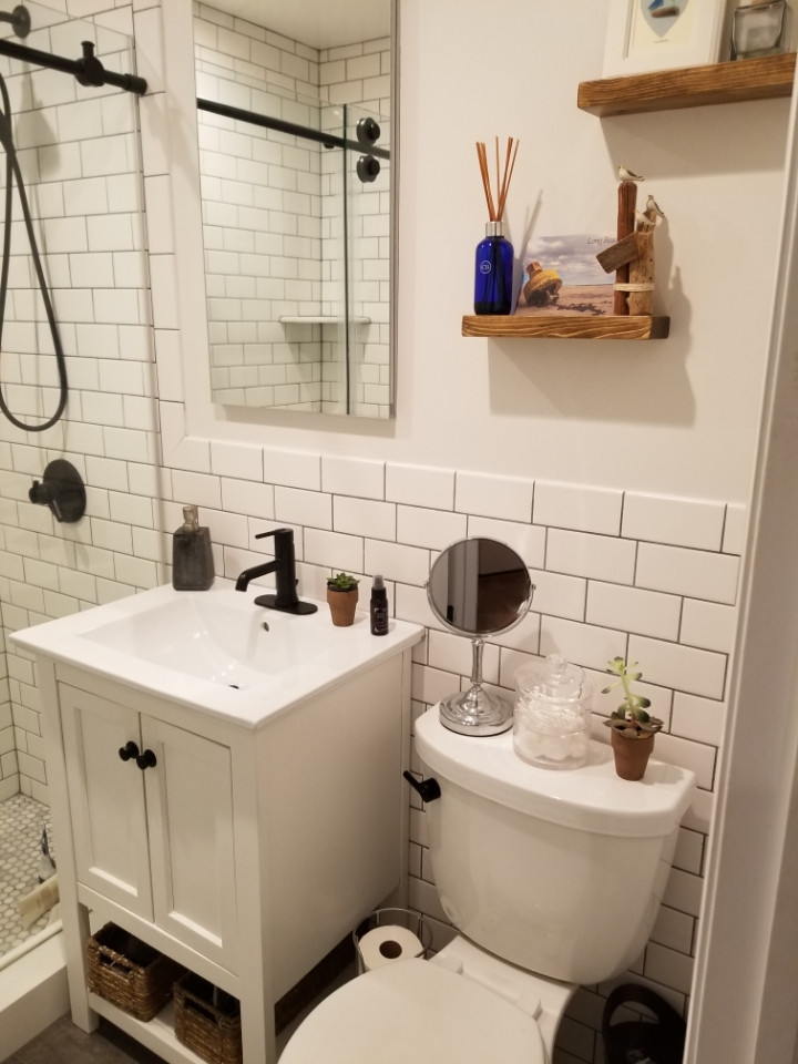 Photo of a small modern master bathroom in New York with furniture-like cabinets, white cabinets, an alcove shower, white tile, subway tile, white walls, quartzite benchtops, a sliding shower screen and white benchtops.