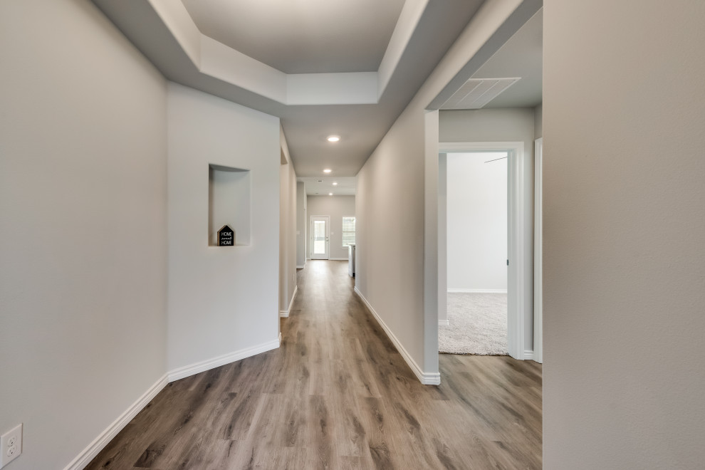 Arts and crafts entryway in Dallas with vinyl floors and recessed.