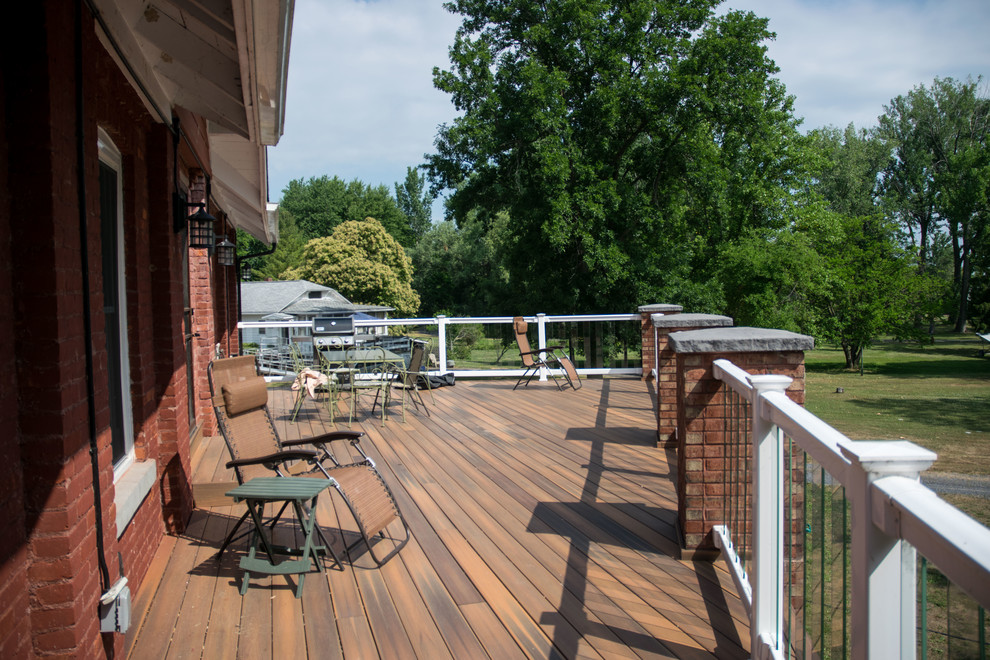 Large industrial backyard deck in New York with no cover.