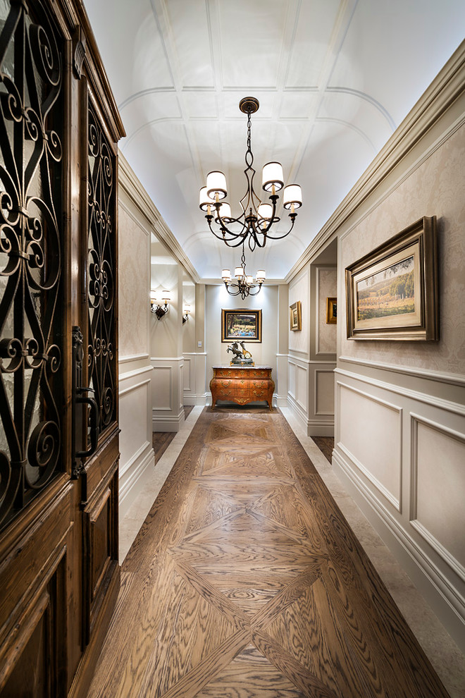 Traditional foyer in Perth with medium hardwood floors and a dark wood front door.