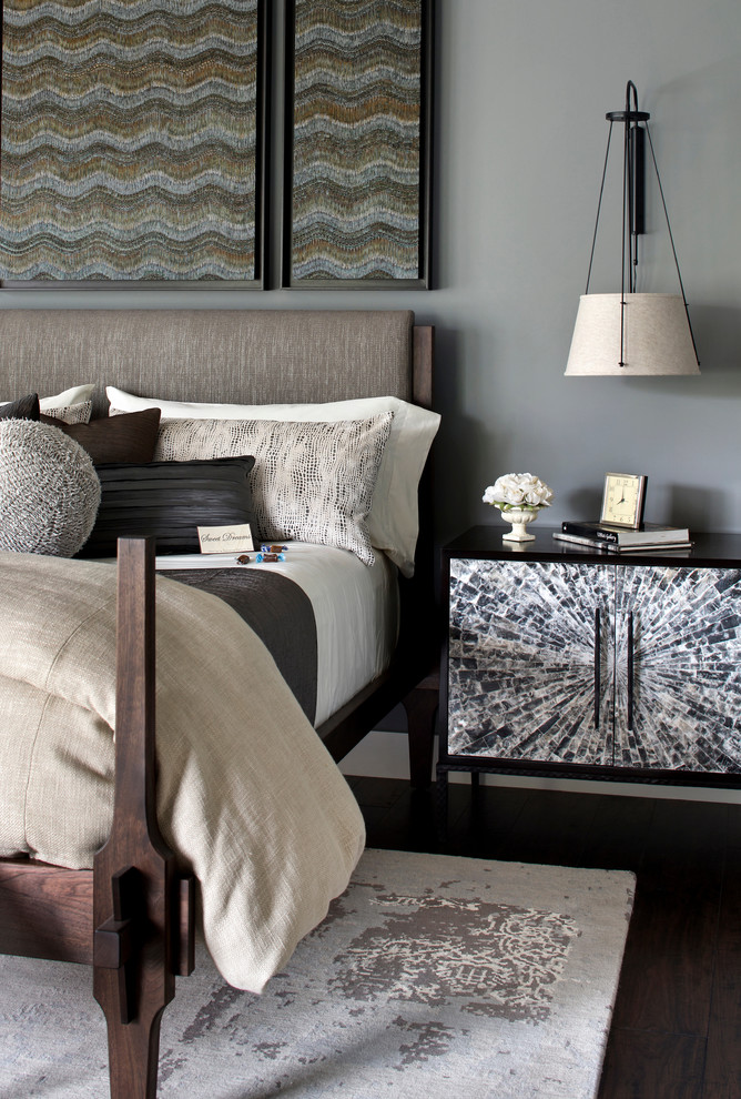 Photo of a transitional bedroom in San Francisco with grey walls and dark hardwood floors.