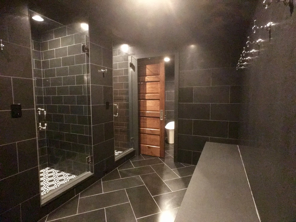 This is an example of a large traditional bathroom in Milwaukee with a one-piece toilet, white walls, mosaic tile floors, an alcove shower, black and white tile and with a sauna.