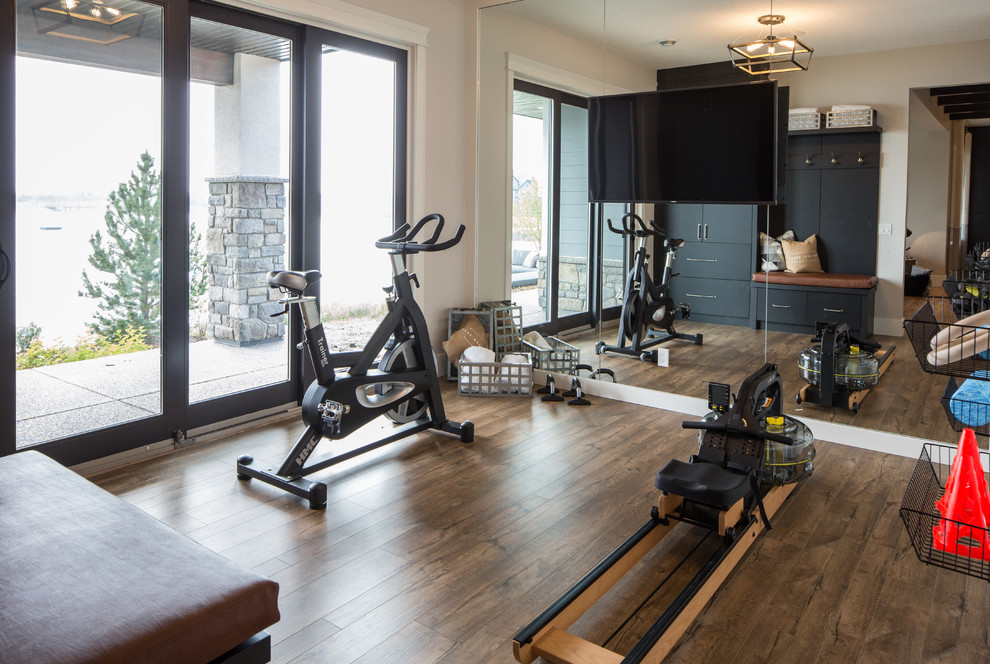 Photo of a mid-sized country multipurpose gym in Calgary with white walls, vinyl floors and brown floor.