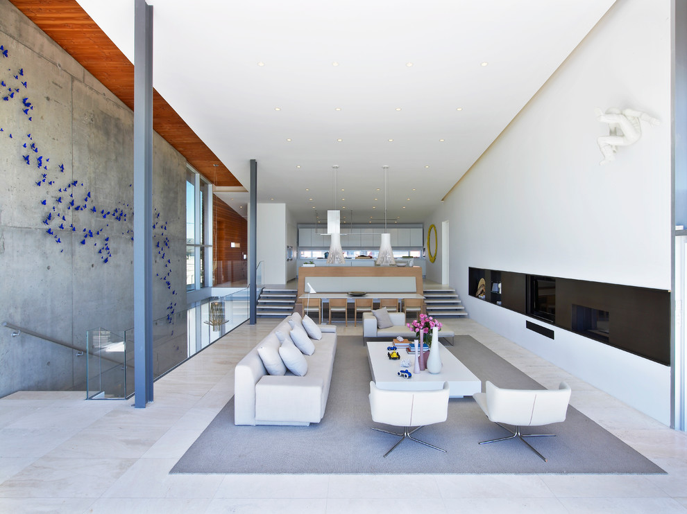 This is an example of a large beach style open concept living room in New York.