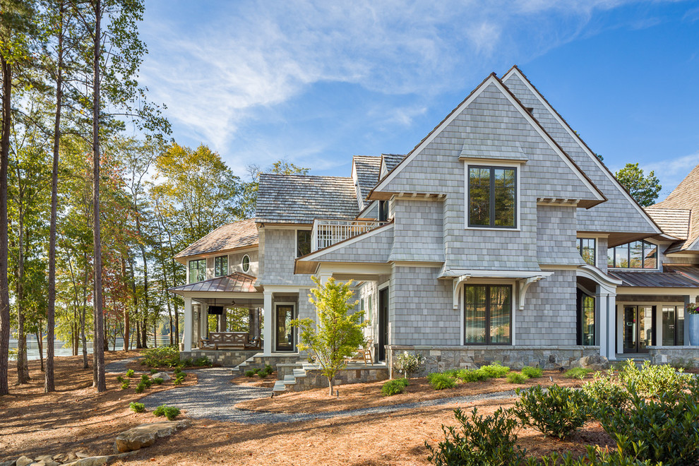 Large transitional gray three-story gable roof idea
