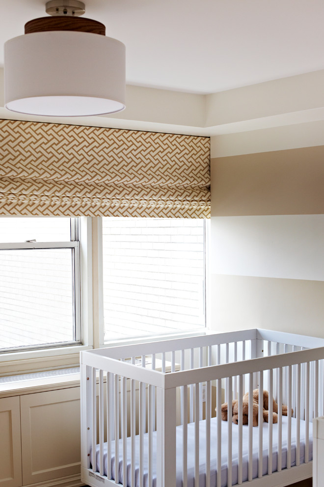 This is an example of a transitional gender-neutral nursery in New York with multi-coloured walls.