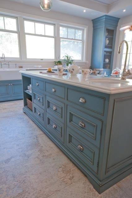 Photo of a large country u-shaped eat-in kitchen in Toronto with a farmhouse sink, beaded inset cabinets, blue cabinets, quartzite benchtops, white splashback, stone slab splashback, stainless steel appliances, ceramic floors and with island.