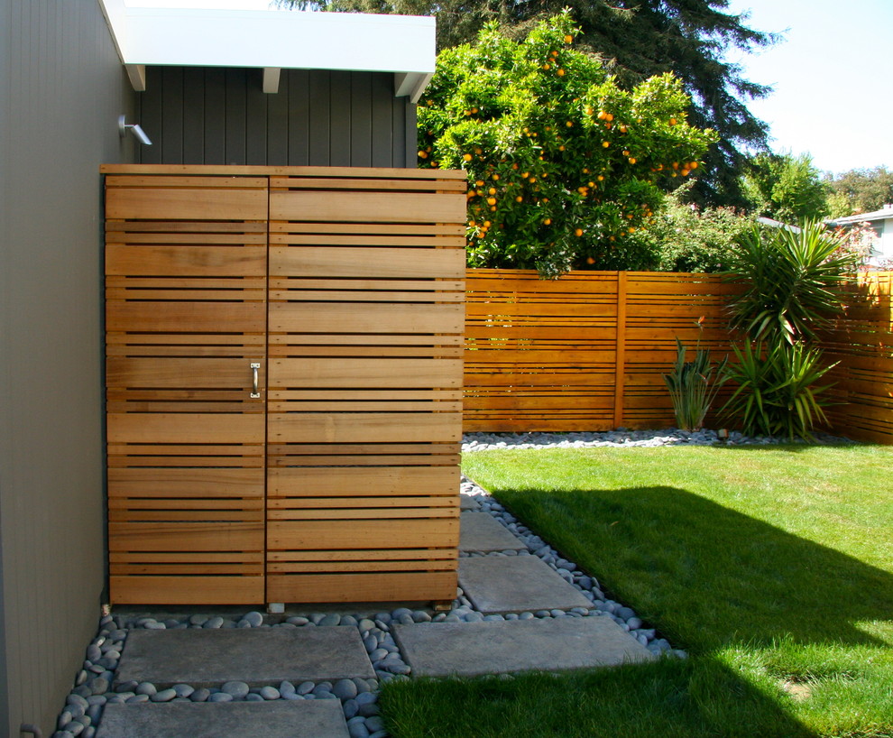 Photo of a mid-sized midcentury grey exterior in San Francisco with wood siding.