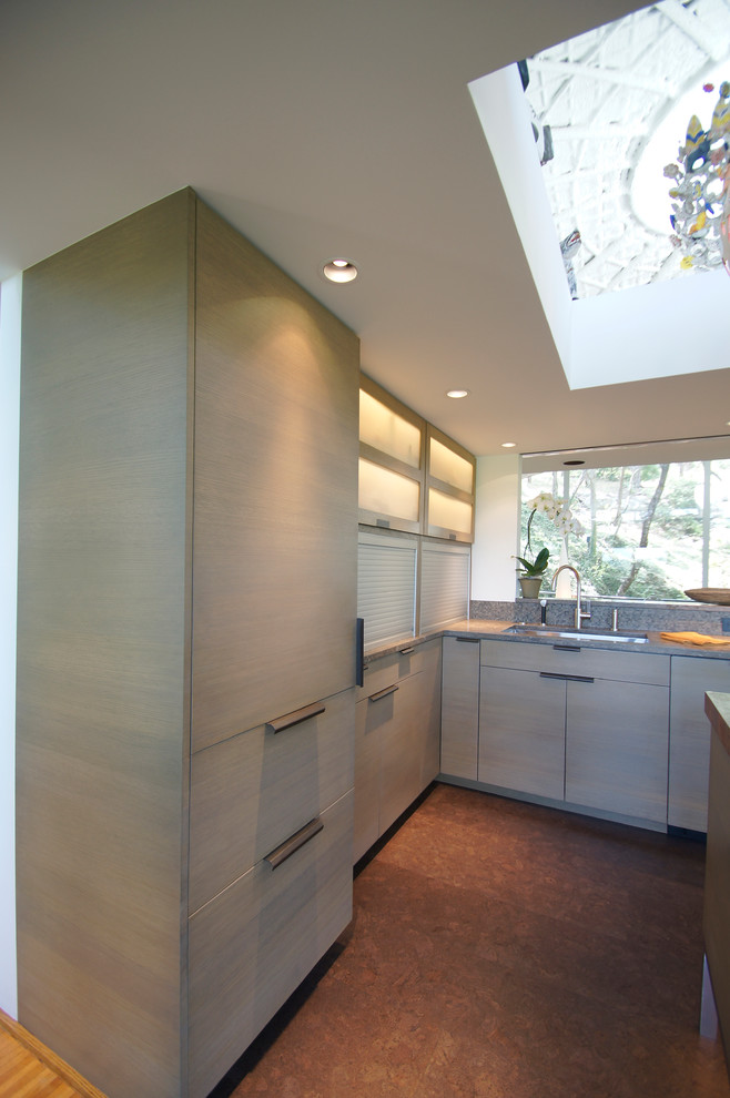 Inspiration for a mid-sized modern u-shaped separate kitchen in Austin with a single-bowl sink, flat-panel cabinets, grey cabinets, limestone benchtops, multi-coloured splashback, mosaic tile splashback, panelled appliances, cork floors and with island.