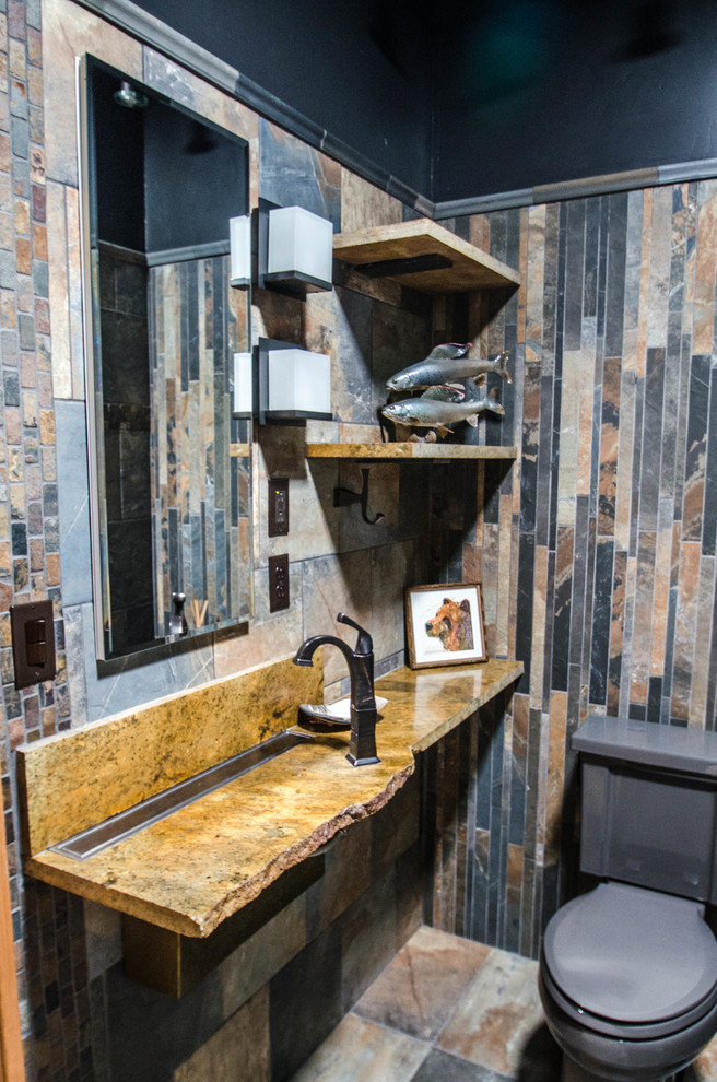 Inspiration for a mid-sized country bathroom in Other with a curbless shower, a two-piece toilet, multi-coloured tile, slate, black walls, slate floors, a wall-mount sink, multi-coloured floor, an open shower and orange benchtops.