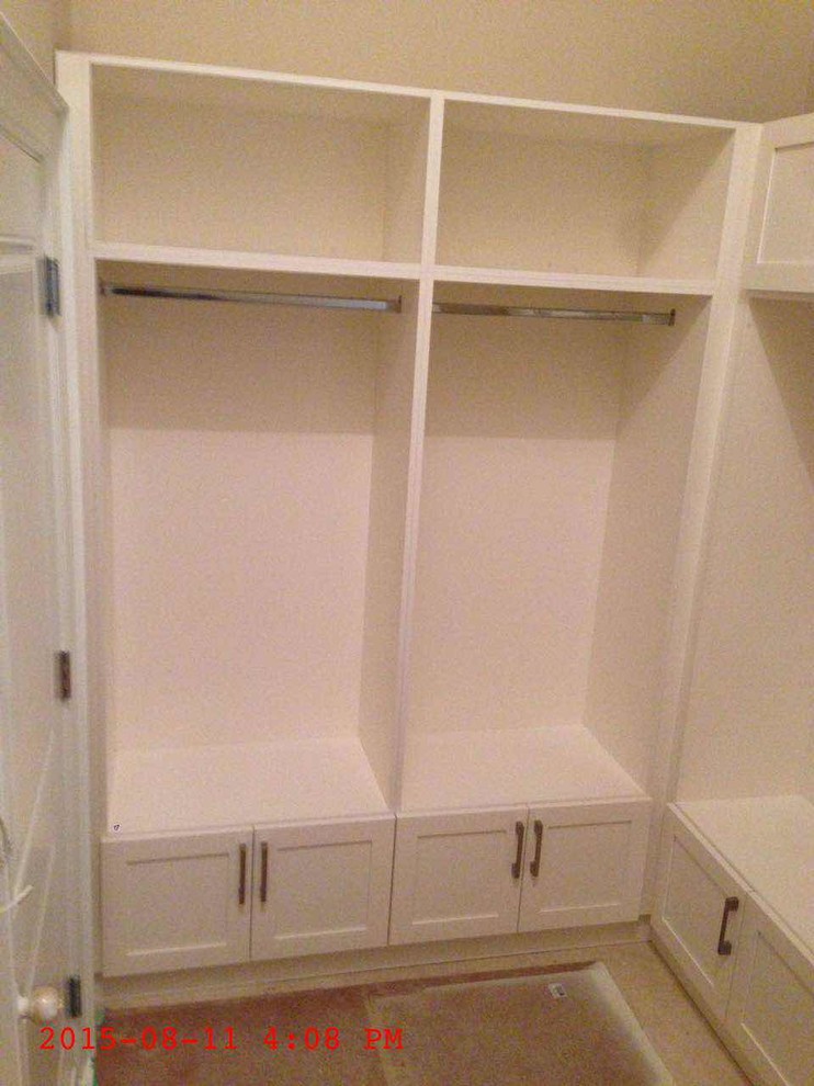 Design ideas for a small women's walk-in wardrobe in Toronto with flat-panel cabinets.