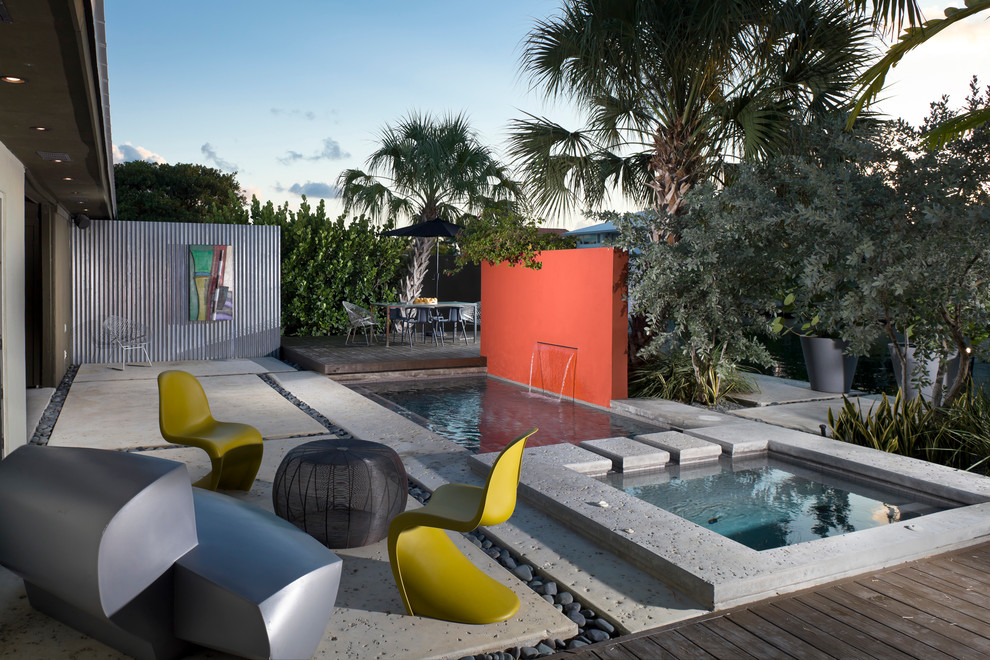 Contemporary patio in Miami with a water feature.