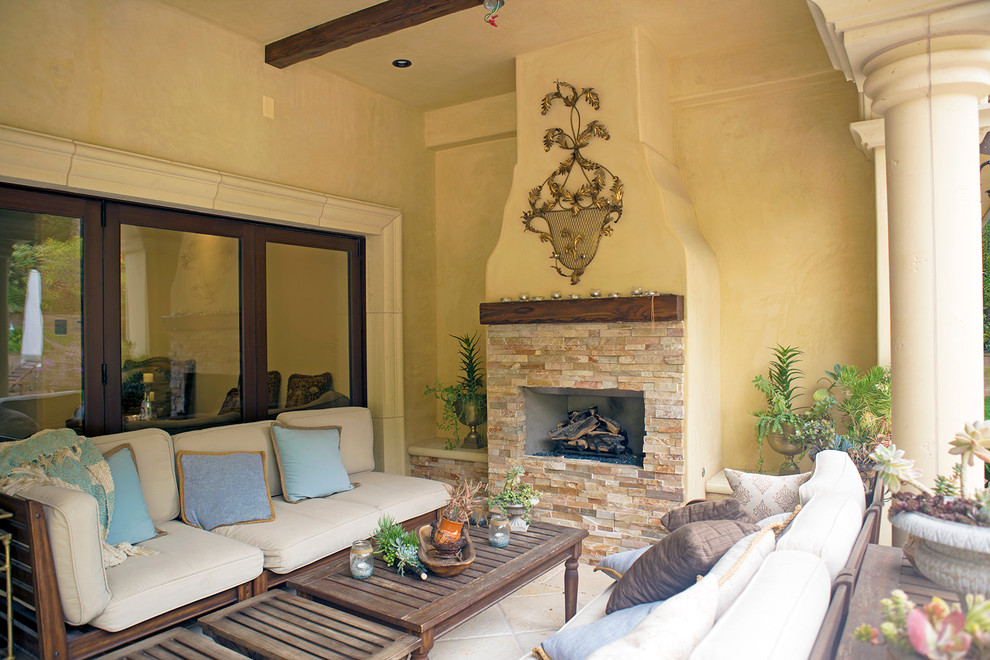 Photo of an expansive mediterranean stucco yellow exterior in Los Angeles.