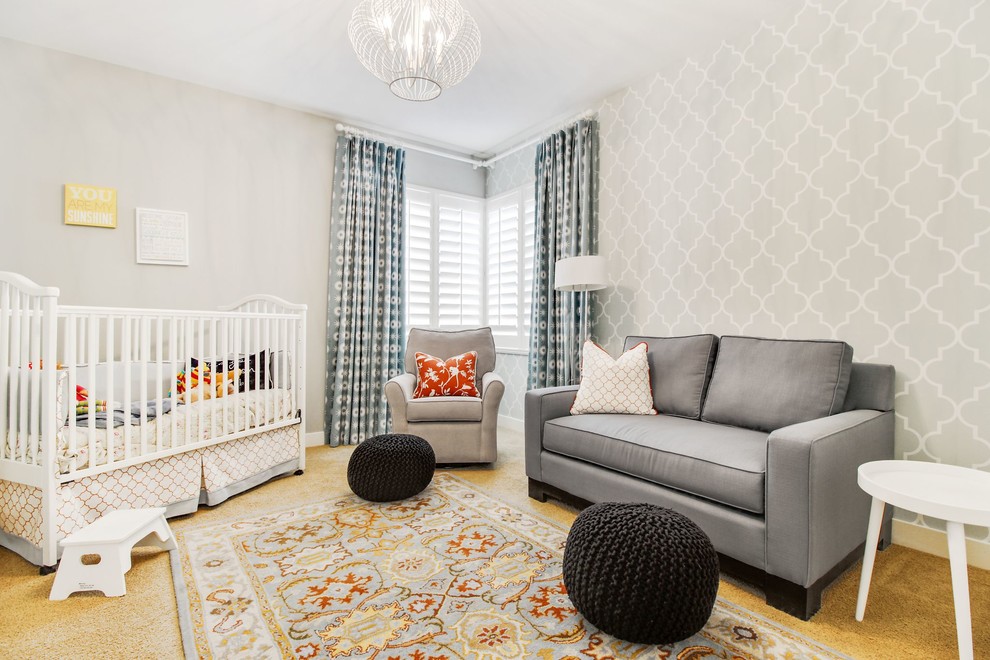 Coastal Classic - Example of a mid-sized transitional gender-neutral carpeted and yellow floor nursery design in San Diego with gray walls