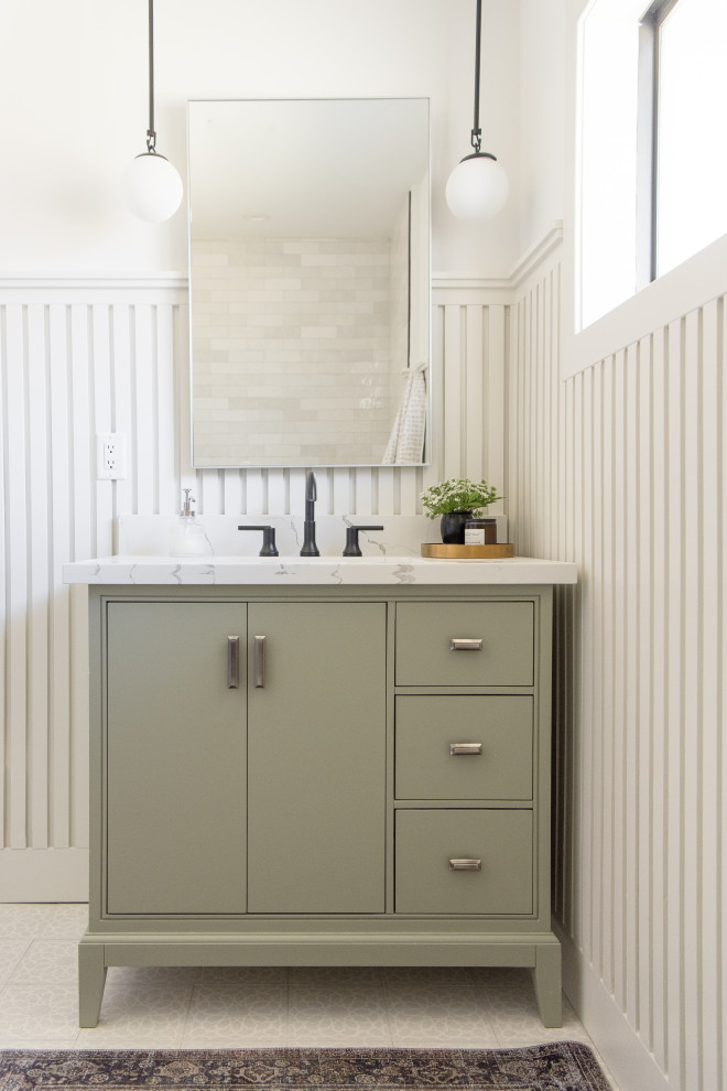 Inspiration for a medium sized classic cloakroom in Phoenix with freestanding cabinets, green cabinets, white walls, mosaic tile flooring, a submerged sink, marble worktops, white floors, white worktops, a freestanding vanity unit and wainscoting.