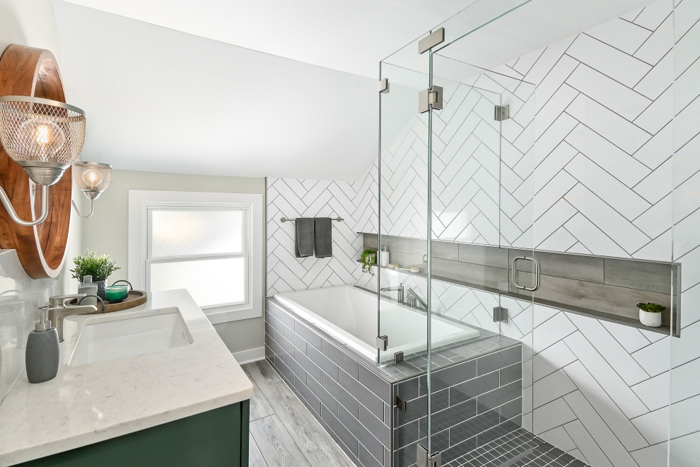This is an example of a small contemporary master bathroom in Milwaukee with shaker cabinets, green cabinets, a drop-in tub, a corner shower, a two-piece toilet, white tile, porcelain tile, beige walls, vinyl floors, an undermount sink, engineered quartz benchtops, brown floor, a hinged shower door, white benchtops, a shower seat, a single vanity and a built-in vanity.