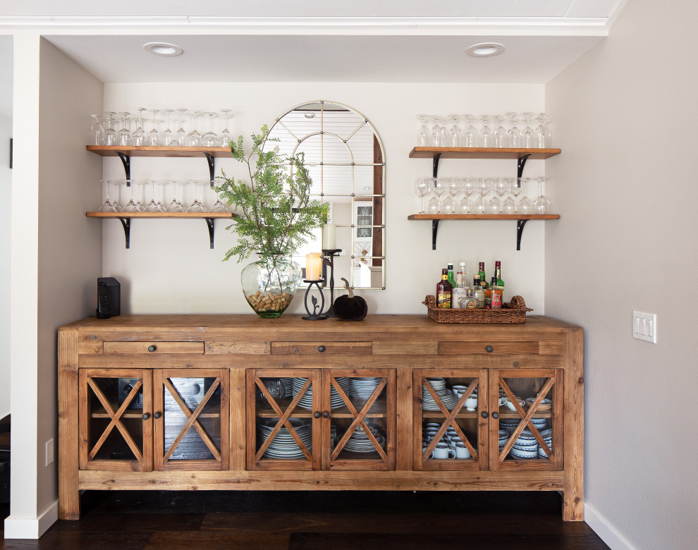 Mid-sized country single-wall home bar in Seattle with glass-front cabinets, medium wood cabinets, dark hardwood floors, brown floor and brown benchtop.