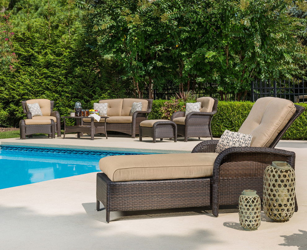 Example of a transitional backyard home design design