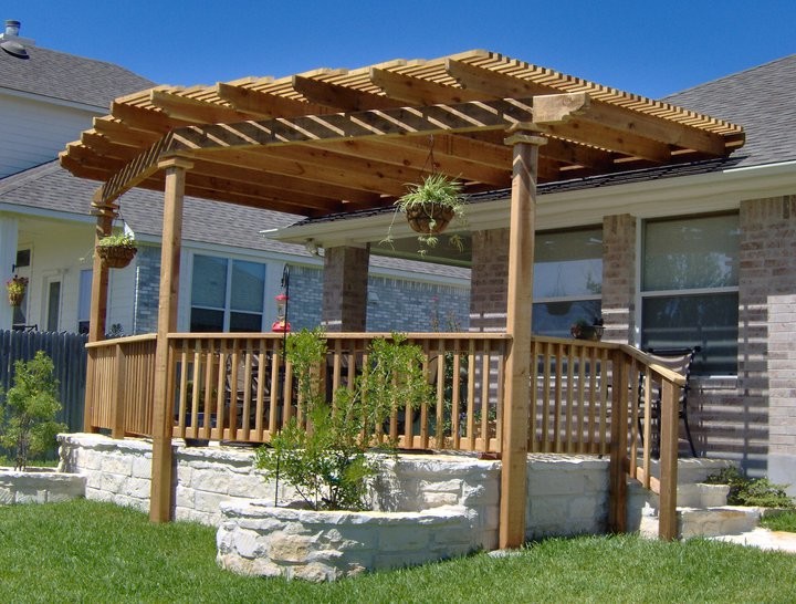 Mid-sized elegant backyard deck photo in Houston with a pergola