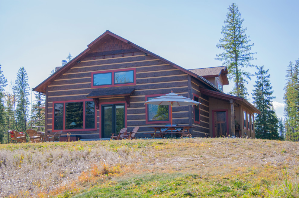 Mid-sized rustic brown two-story wood gable roof idea with a shingle roof