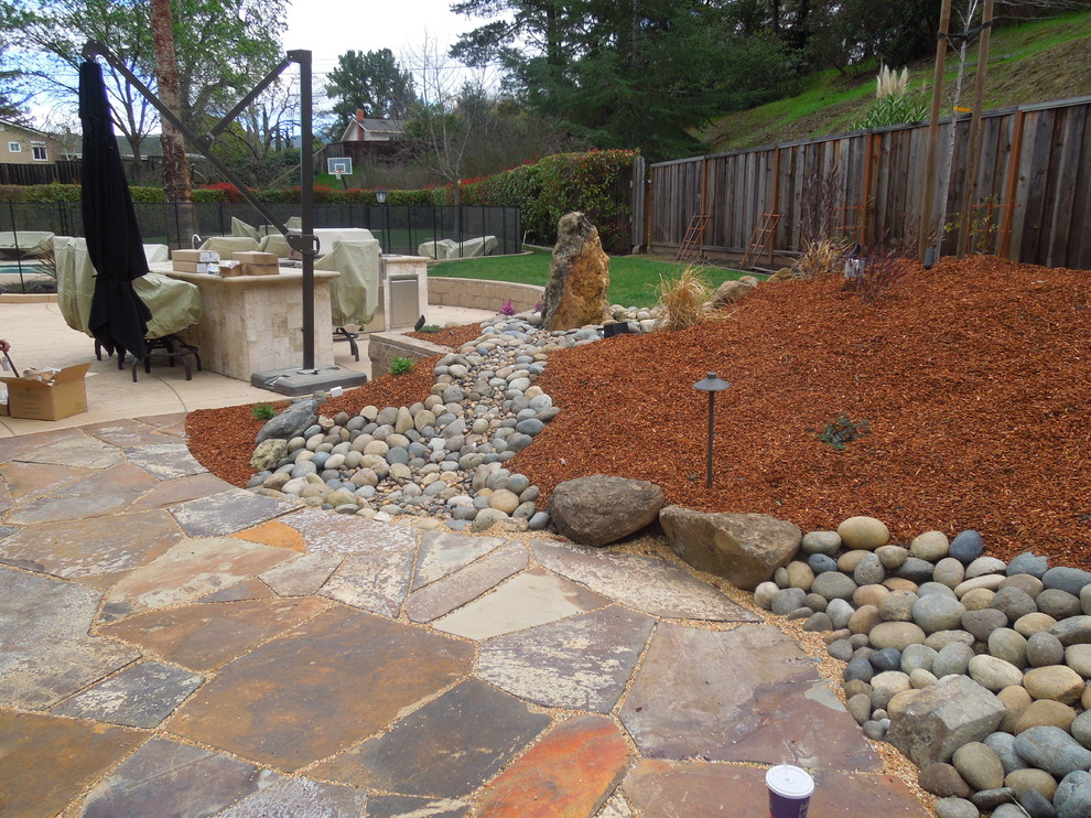 Unused sideyard turns into fantastic firepit area with water feature