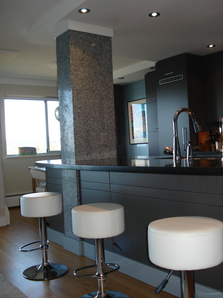 Eat-in kitchen - small transitional single-wall light wood floor eat-in kitchen idea in Orange County with a double-bowl sink, flat-panel cabinets, gray cabinets, quartz countertops, gray backsplash, mosaic tile backsplash and stainless steel appliances