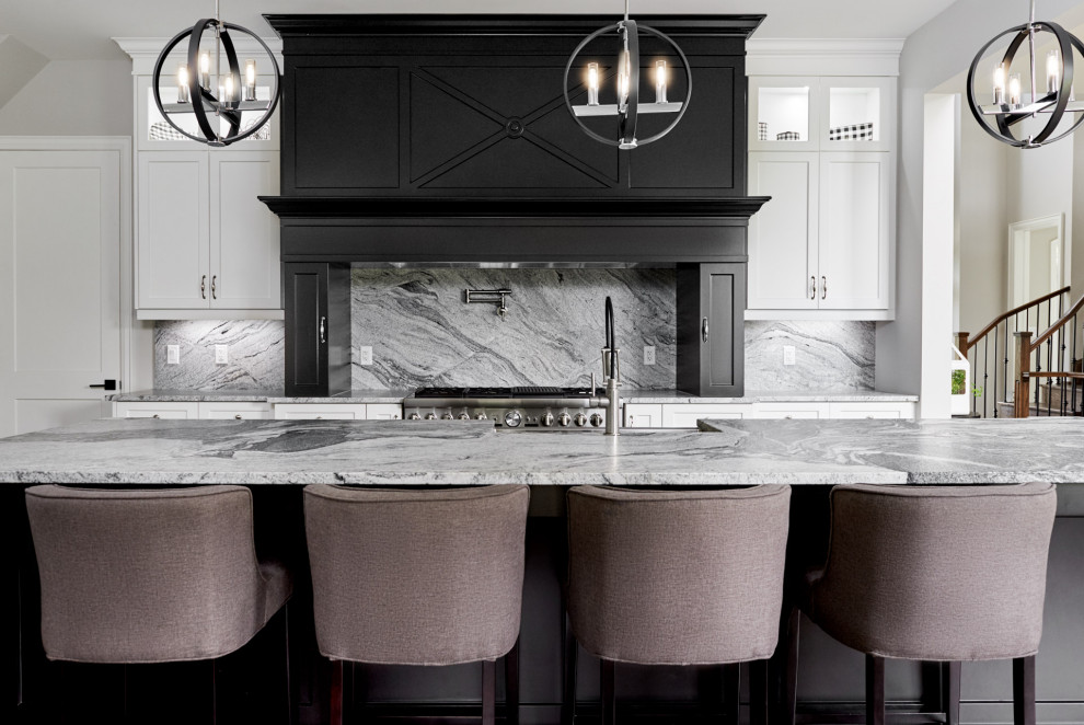 Eat-in kitchen - huge transitional light wood floor and brown floor eat-in kitchen idea in Toronto with a farmhouse sink, shaker cabinets, white cabinets, granite countertops, gray backsplash, granite backsplash, stainless steel appliances, an island and gray countertops