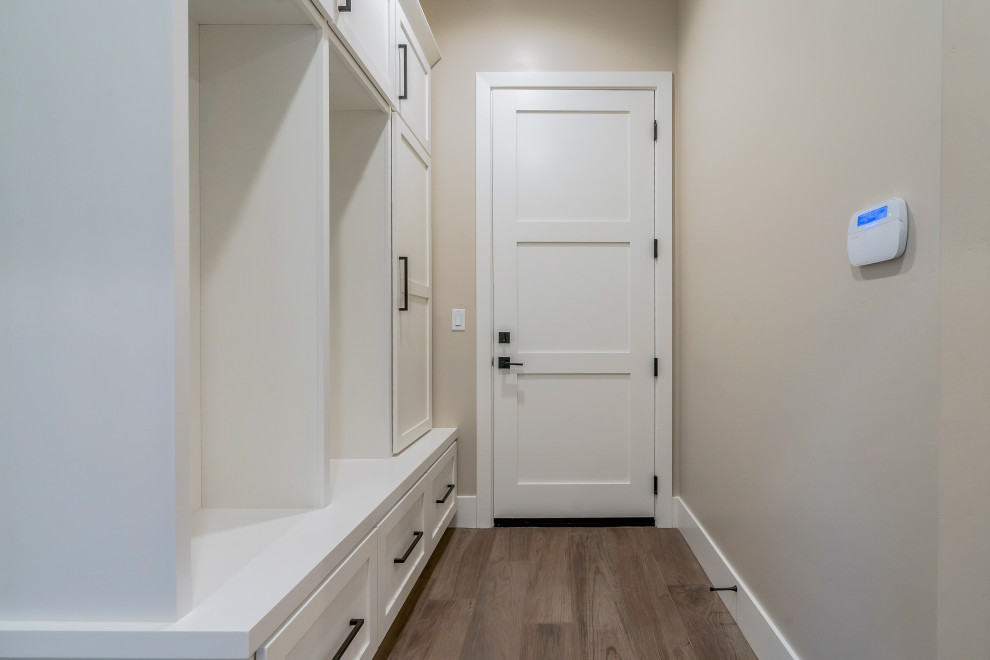 Photo of a mid-sized modern mudroom in Phoenix with ceramic floors and a single front door.