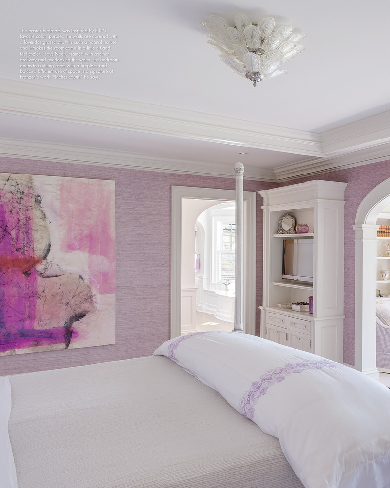 Large traditional master bedroom in New York with purple walls and light hardwood floors.