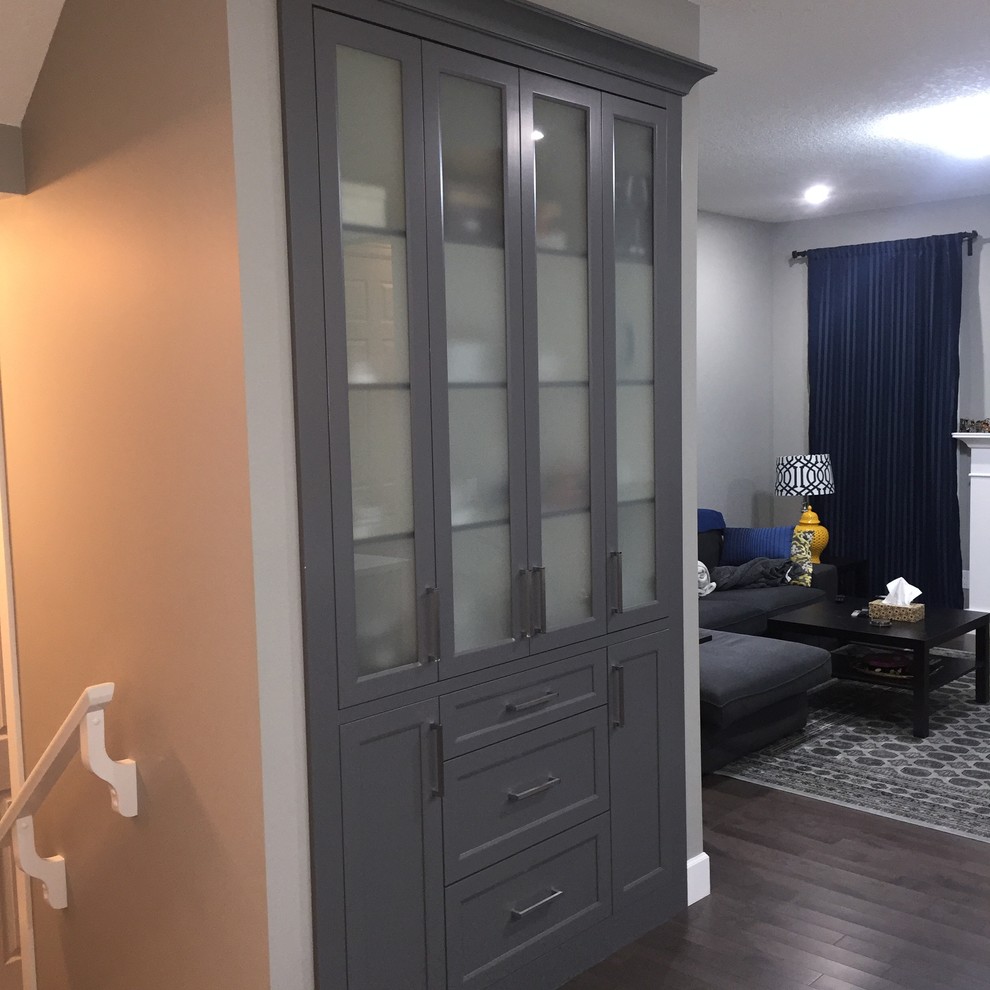 Inspiration for a mid-sized single-wall dark wood floor eat-in kitchen remodel in Calgary with an undermount sink, shaker cabinets, white cabinets, quartzite countertops, gray backsplash, subway tile backsplash, stainless steel appliances and an island