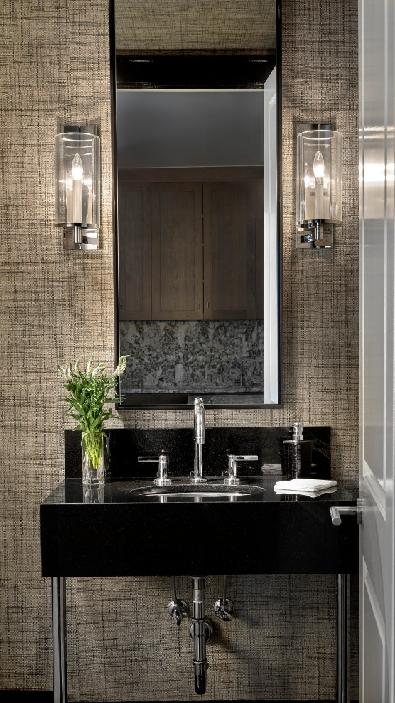 Photo of a mid-sized contemporary bathroom in Chicago with black cabinets, brown walls, an undermount sink, onyx benchtops, black benchtops, a single vanity, a freestanding vanity and wallpaper.