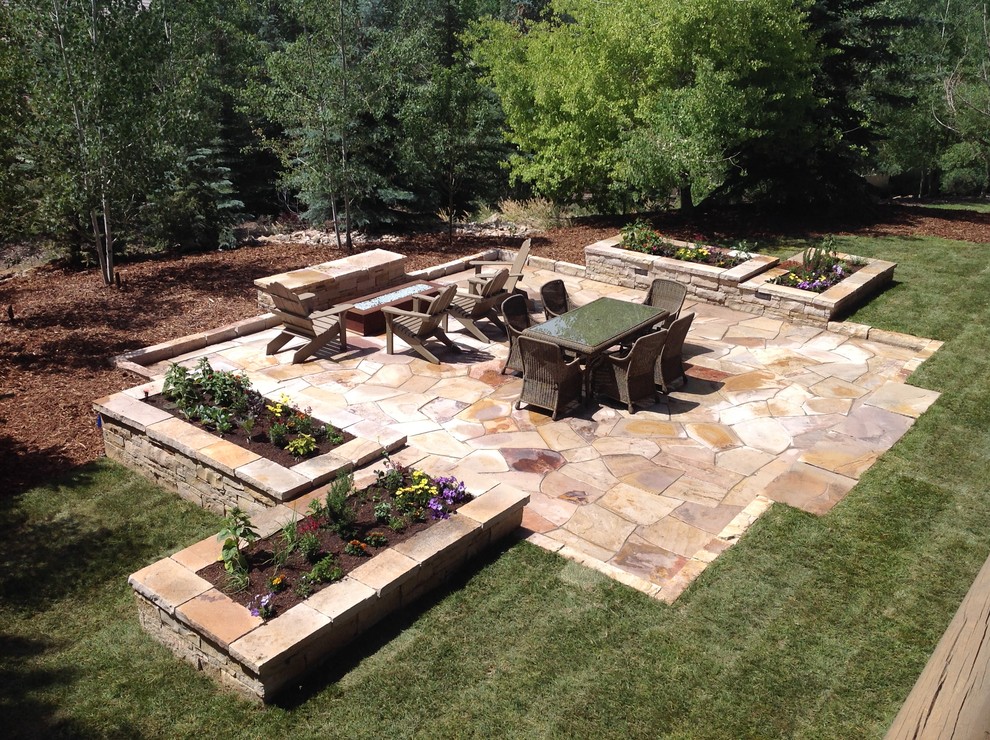 Design ideas for a large country backyard patio in Salt Lake City with a fire feature and no cover.
