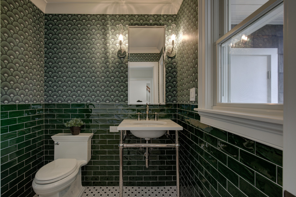 Mid-sized transitional green tile and ceramic tile mosaic tile floor, multicolored floor and wallpaper powder room photo with a one-piece toilet, green walls, an undermount sink, solid surface countertops and white countertops
