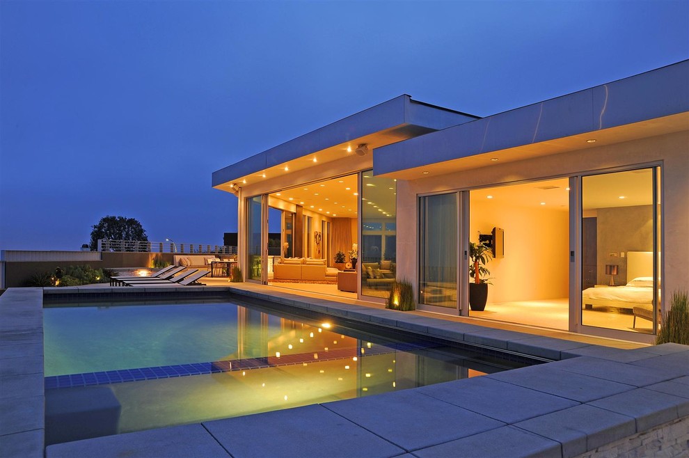 Modern one-storey glass exterior in Los Angeles with a flat roof.