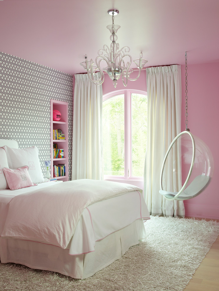 Transitional kids' room in Houston with light hardwood floors, beige floor and multi-coloured walls for girls.