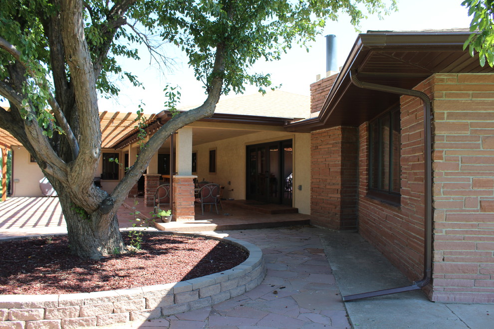 Inspiration for a rustic home design remodel in Denver