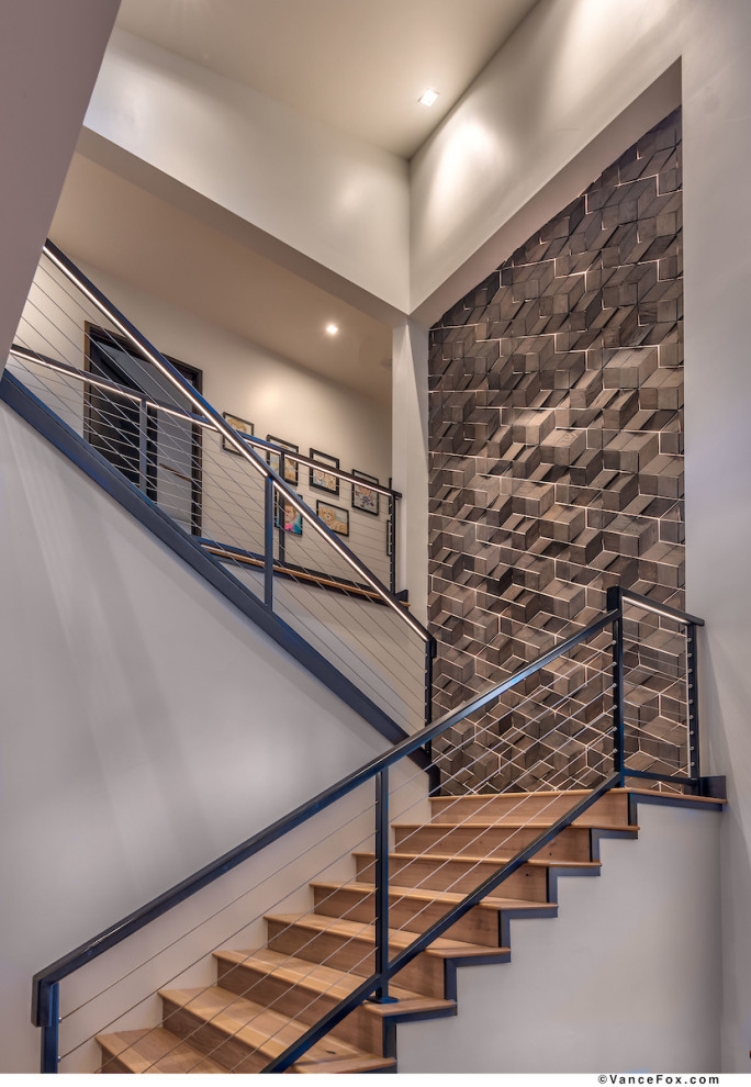 Example of a mid-sized transitional metal railing staircase design