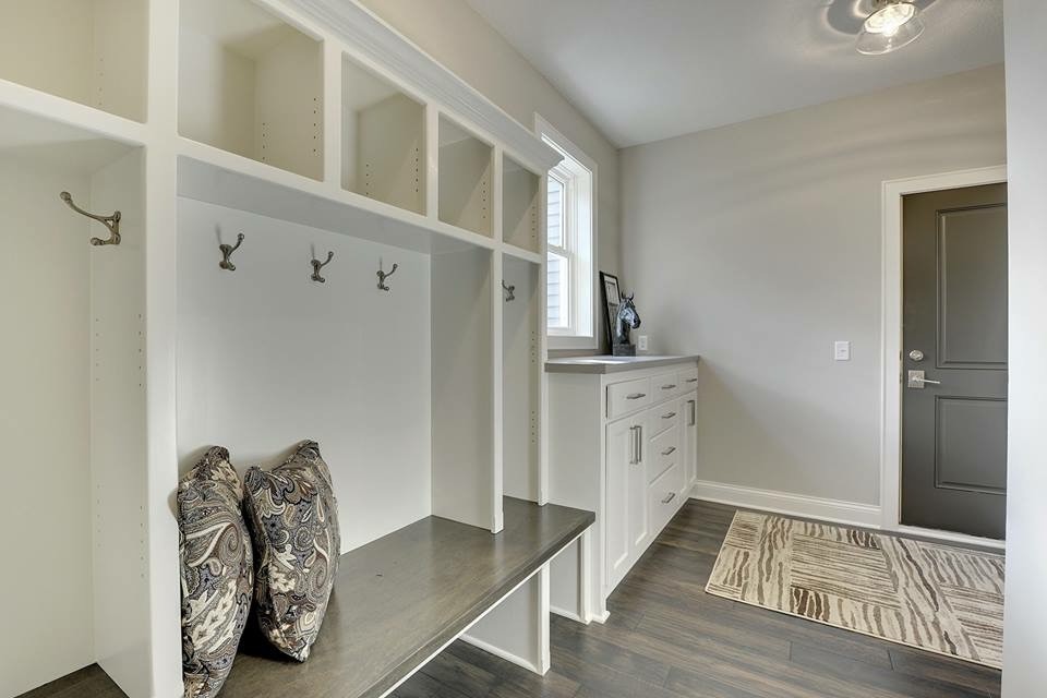 Inspiration for a mid-sized transitional mudroom in Minneapolis with grey walls, porcelain floors, a single front door and a gray front door.