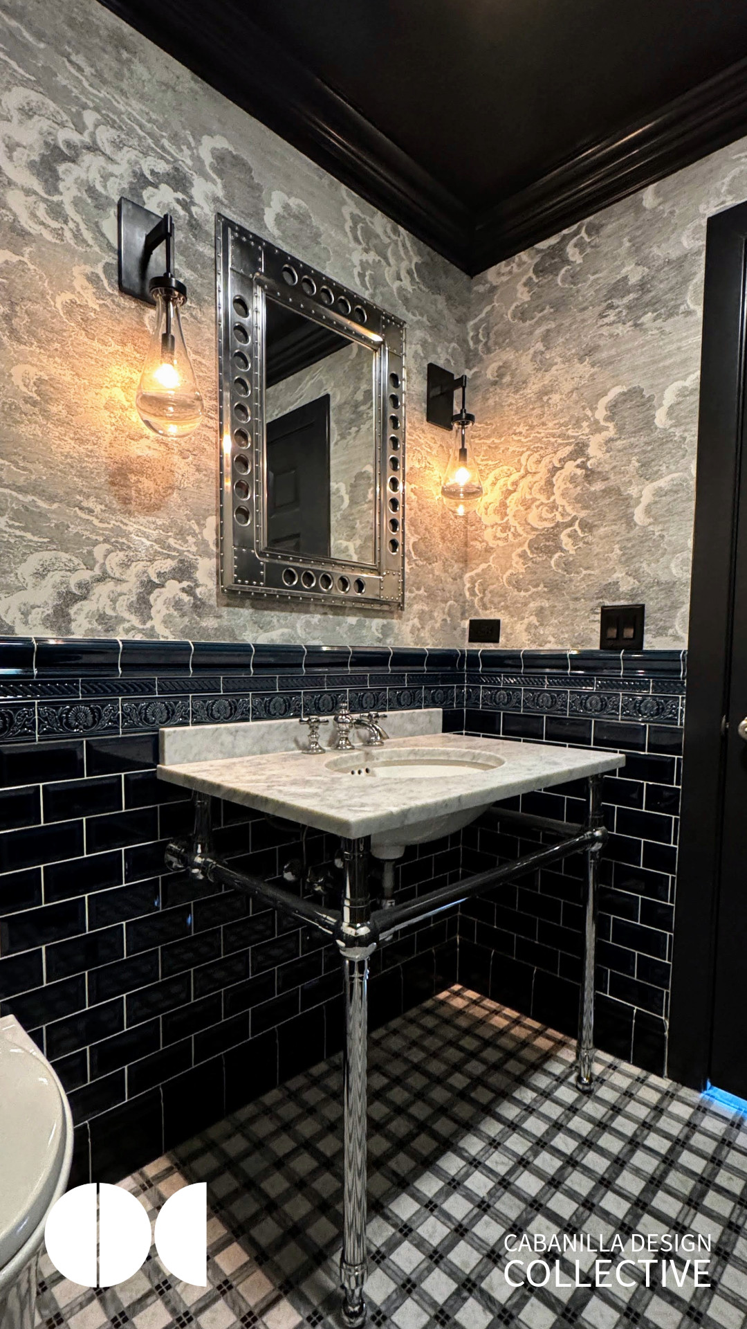 A dramatic powder room on the Car Condo mezzanine, completing our British Victorian design theme. This bespoke space features a stunning Tartan plaid marble floor mosaic and authentic London Undergrou