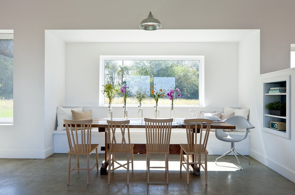 Photo of a country dining room in Providence with white walls.